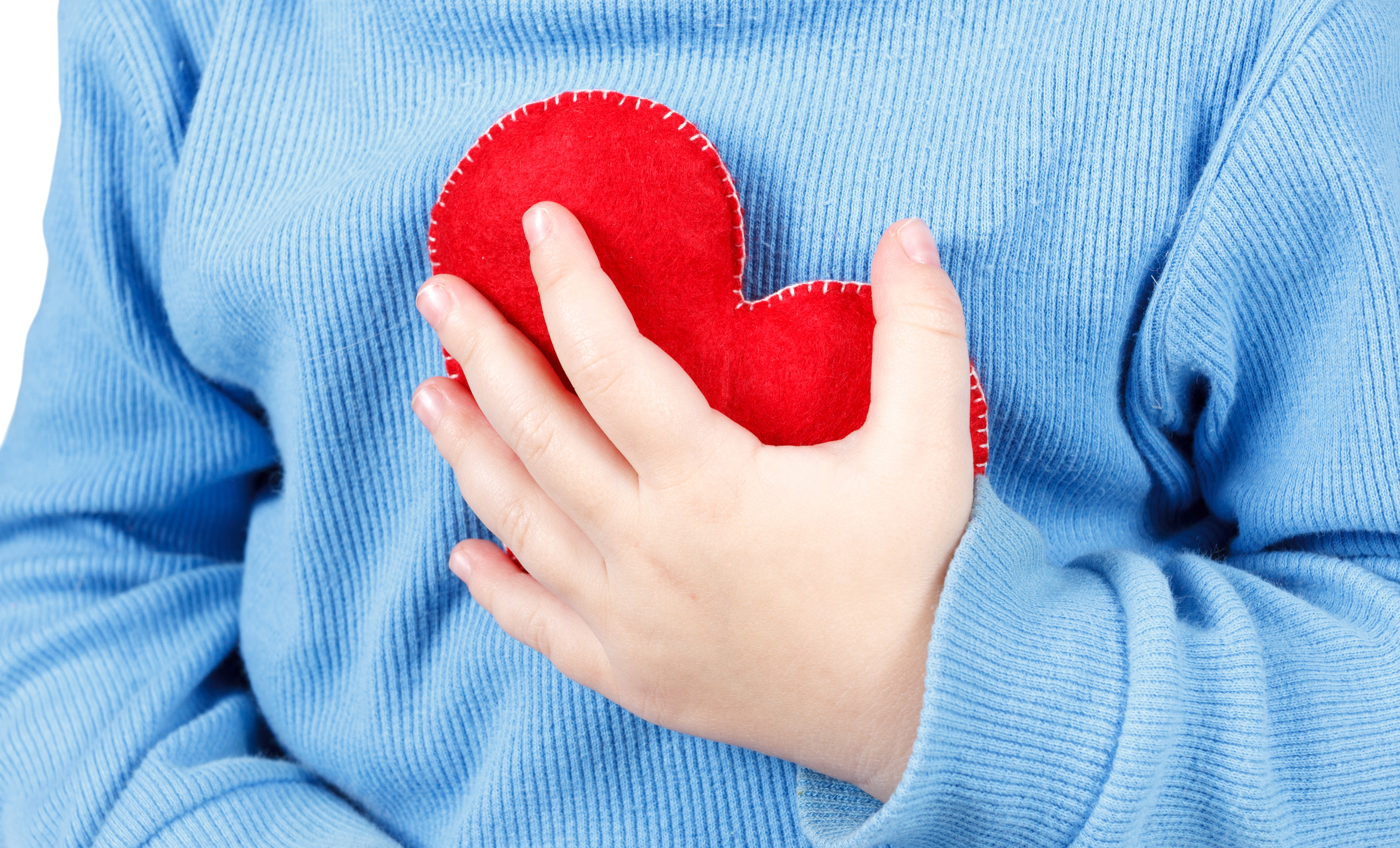 Hands holding baby heart symbol. Concept of love and care